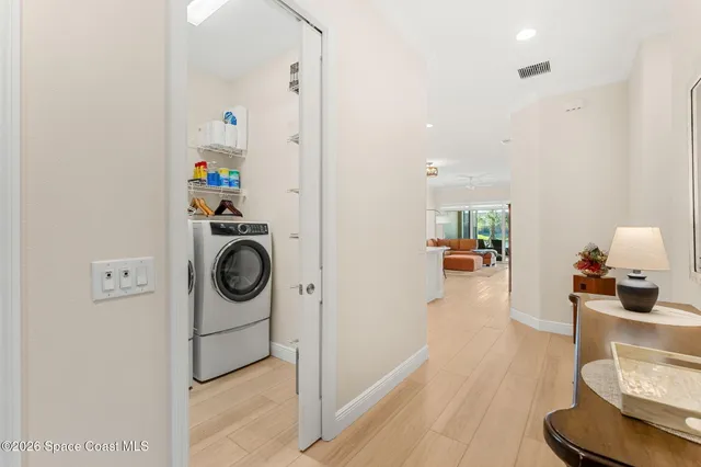 a view of a kitchen with stainless steel appliances
