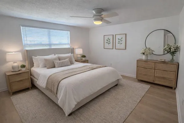 a bedroom with a bed and a dresser