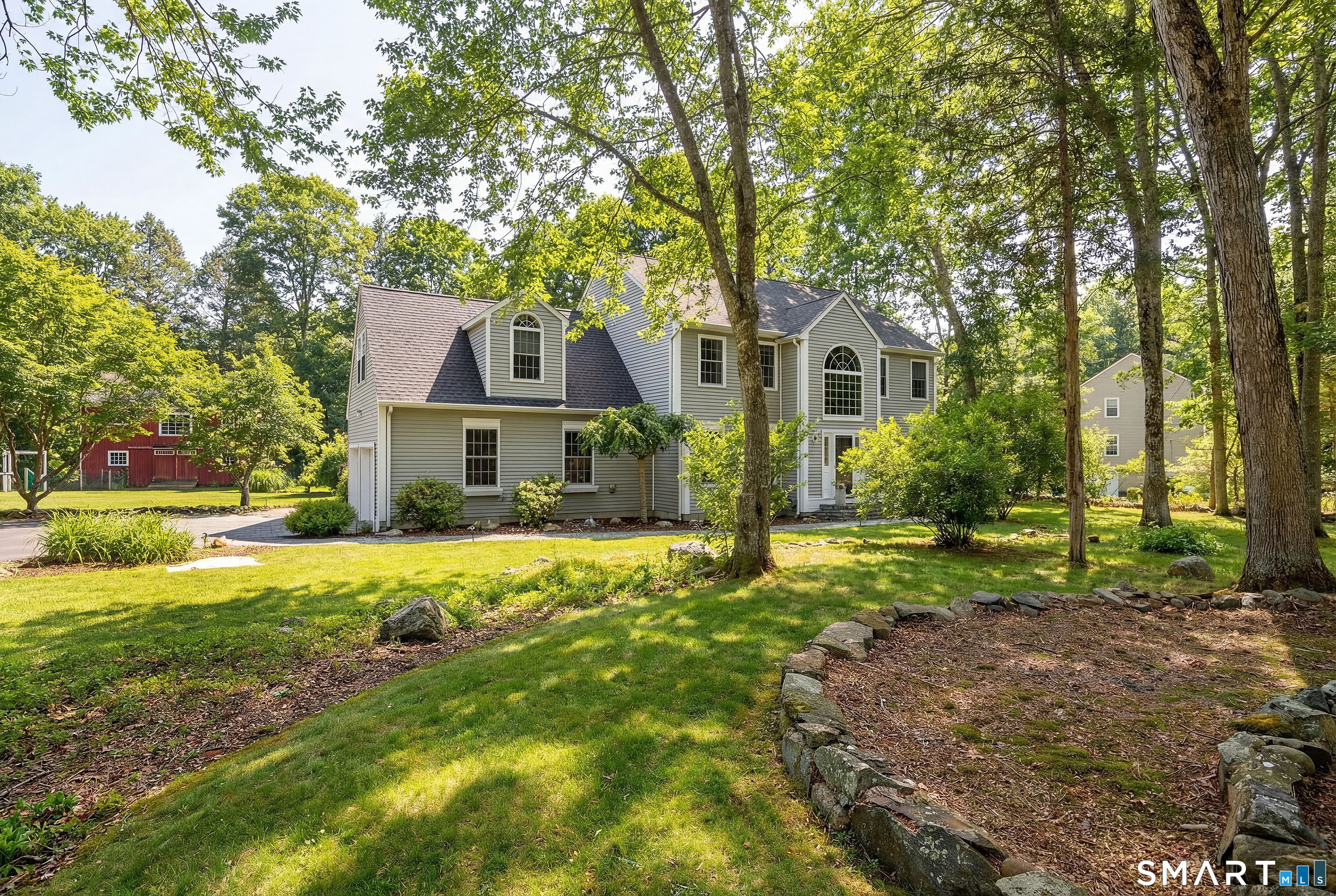 10 Sweetbriar Lane Newtown, CT 06482 - Photo 1 of 1 a front view of a house with a yard