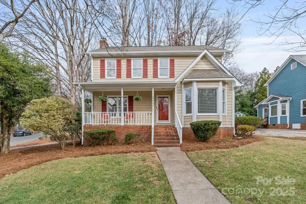 front view of a house with a yard