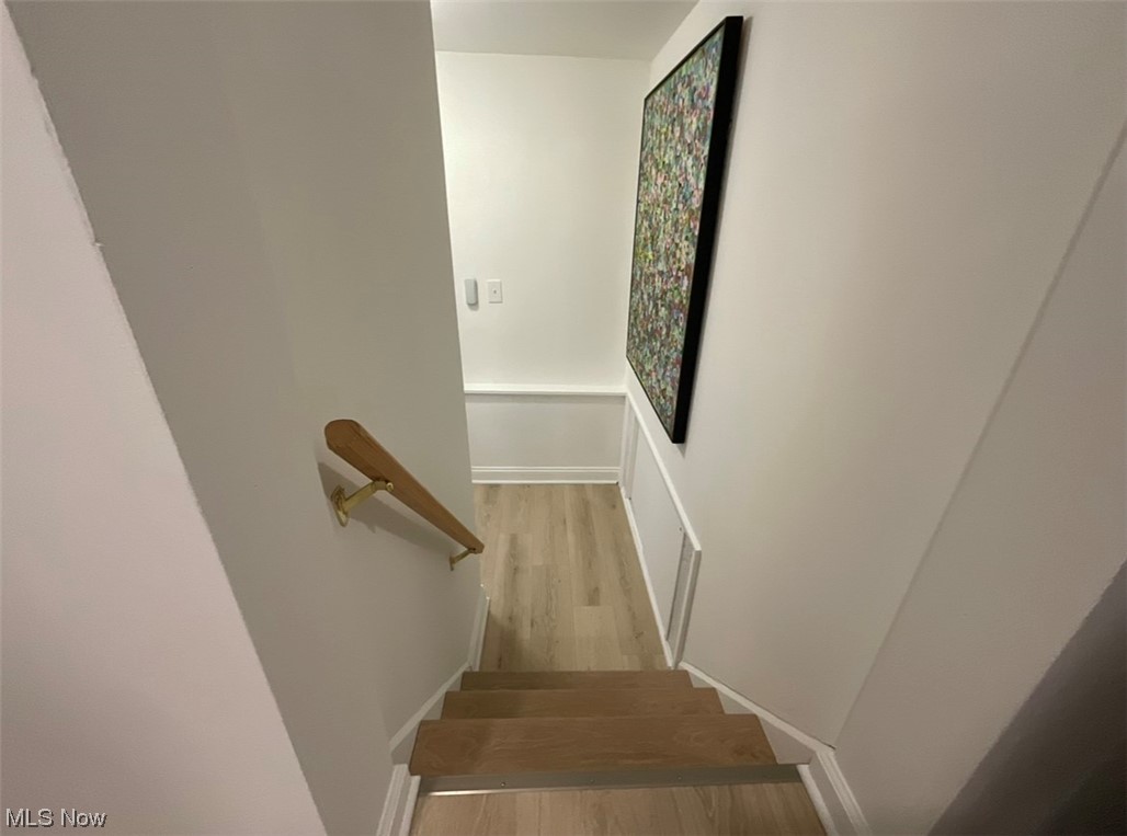 6303 Hillside Road Independence, OH 44131 - Photo 8 of 14 Stairway featuring light hardwood / wood-style flooring