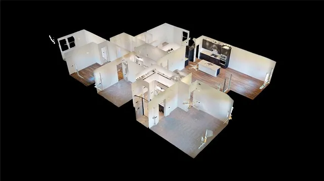 a view of a backyard with a garden and entertaining space