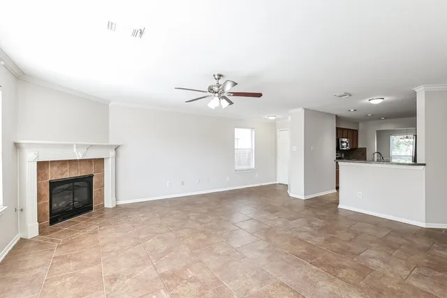 a view of an empty room with a fireplace