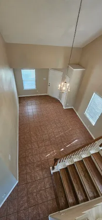 an empty room with wooden floor