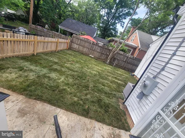 a view of a backyard with a small cabin