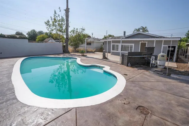 an aerial view of a house with swimming pool