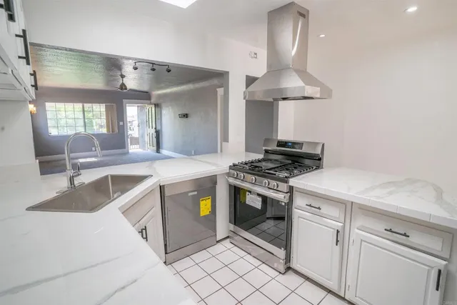 a kitchen with a stove and a sink