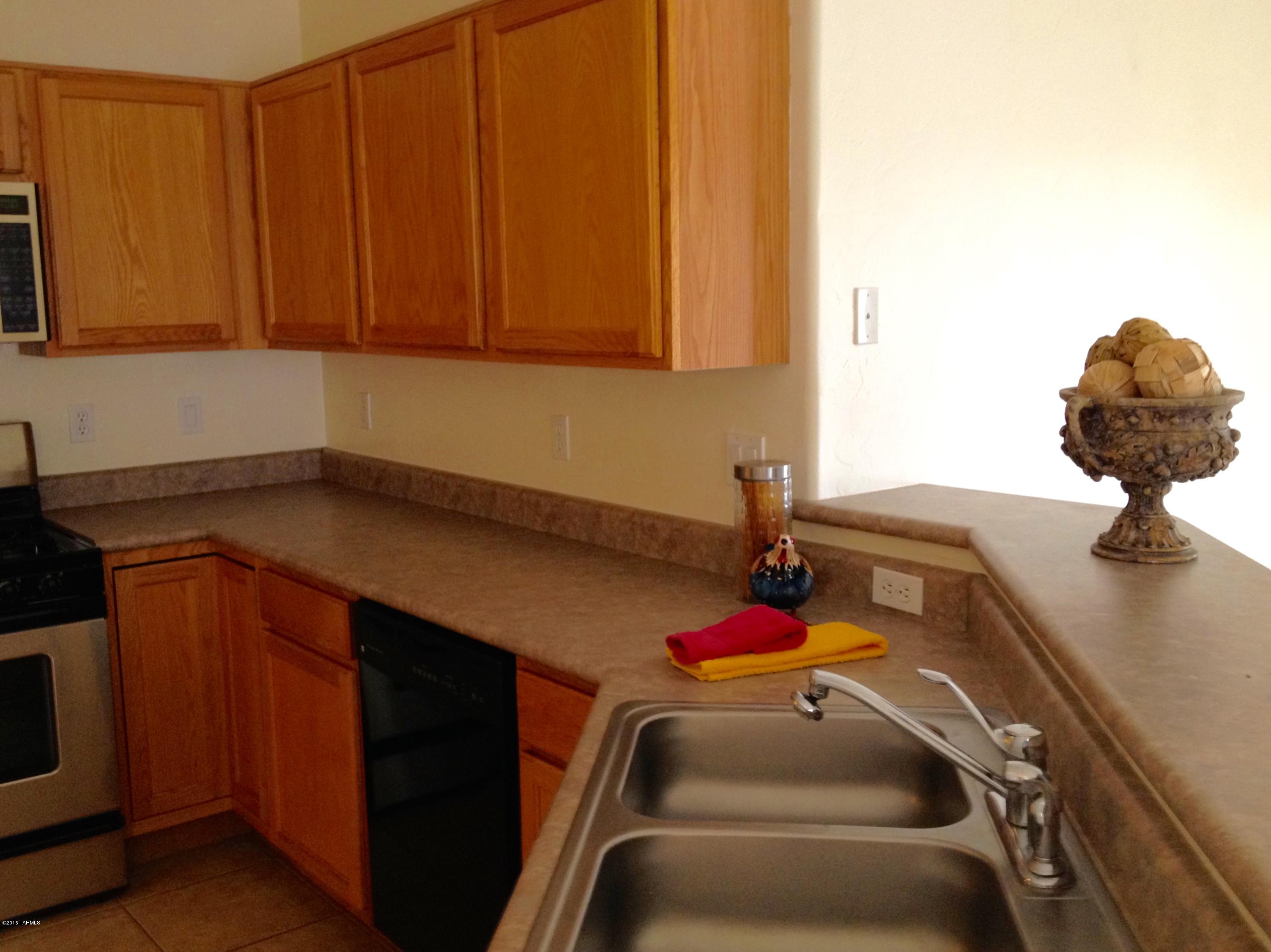 7931 North Iron Ridge Drive Tucson, AZ 85743 - Photo 10 of 21 a utility room with dryer and washer