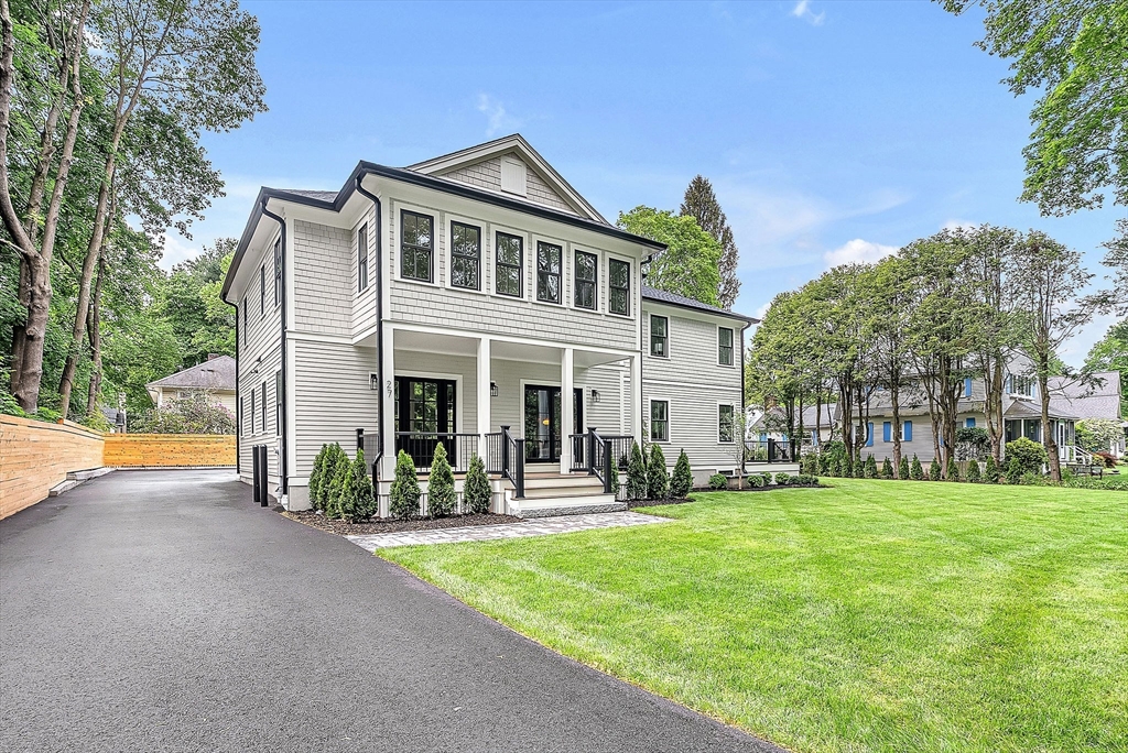 27 Boulevard Road Wellesley, MA 02481 - Photo 2 of 3 a front view of a house with a yard