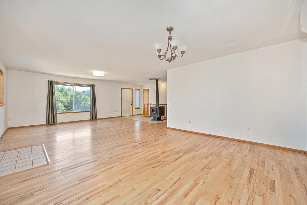 4751 Meadowview Acres Road Cool, CA 95614 - Photo 13 of 51 wooden floor in an empty room with a window