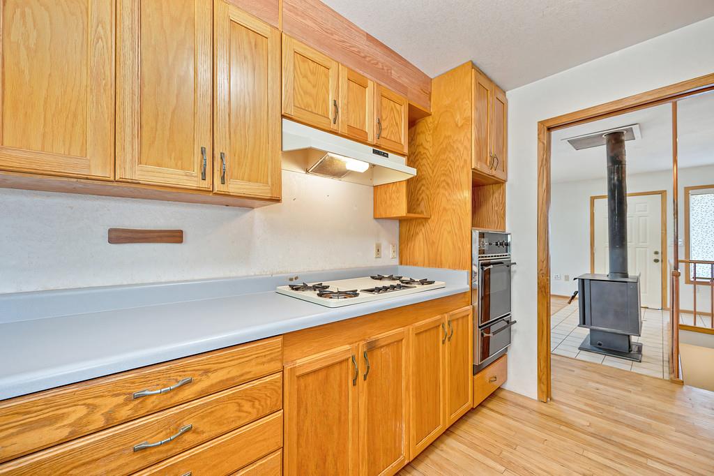 4751 Meadowview Acres Road Cool, CA 95614 - Photo 15 of 51 a kitchen with stainless steel appliances granite countertop a stove a sink and a refrigerator