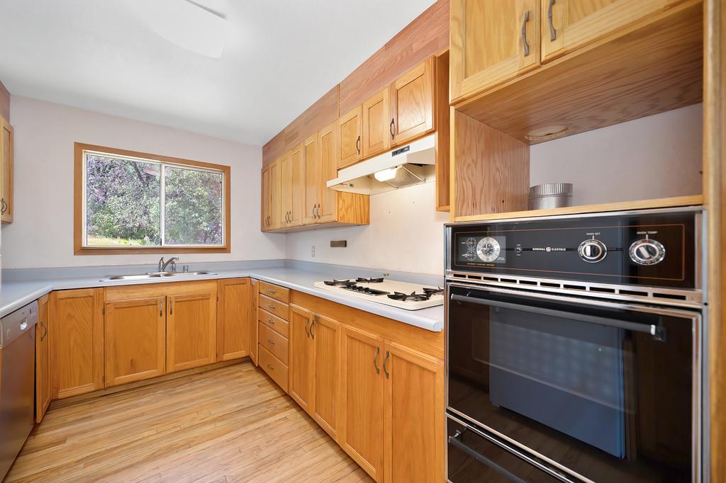 4751 Meadowview Acres Road Cool, CA 95614 - Photo 17 of 51 a kitchen with stainless steel appliances granite countertop a stove and a sink