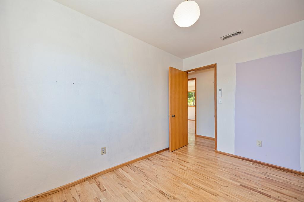 4751 Meadowview Acres Road Cool, CA 95614 - Photo 27 of 51 a view of empty room with wooden floor