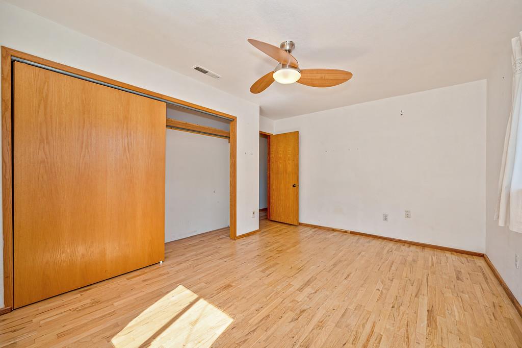 4751 Meadowview Acres Road Cool, CA 95614 - Photo 29 of 51 a view of an empty room with wooden floor and a window