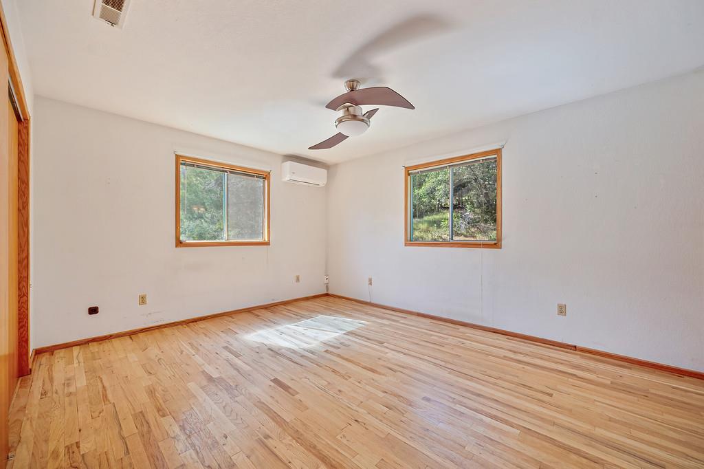 4751 Meadowview Acres Road Cool, CA 95614 - Photo 30 of 51 a view of empty room with wooden floor and fan