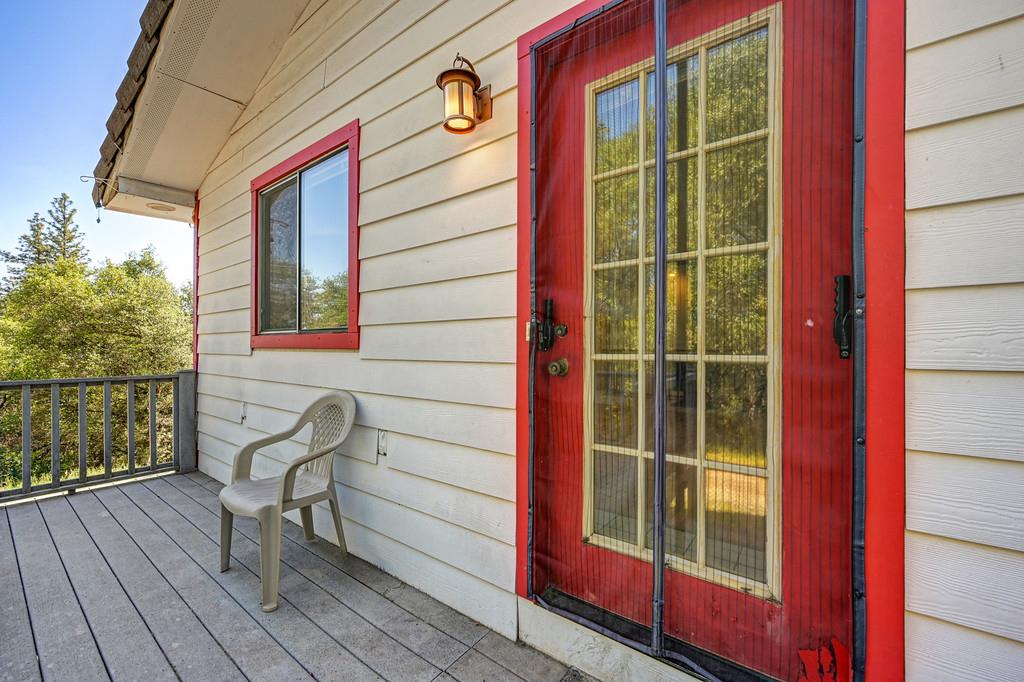 4751 Meadowview Acres Road Cool, CA 95614 - Photo 3 of 51 a view of a door with a bench and wooden floor