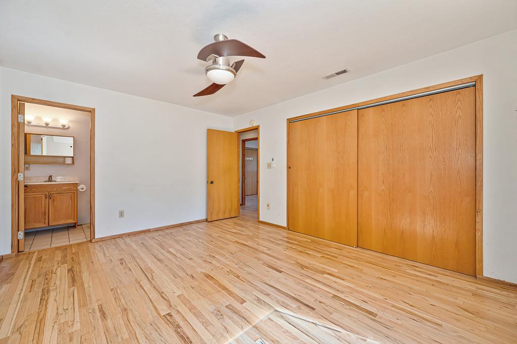 4751 Meadowview Acres Road Cool, CA 95614 - Photo 31 of 51 a view of empty room with wooden floor and fan