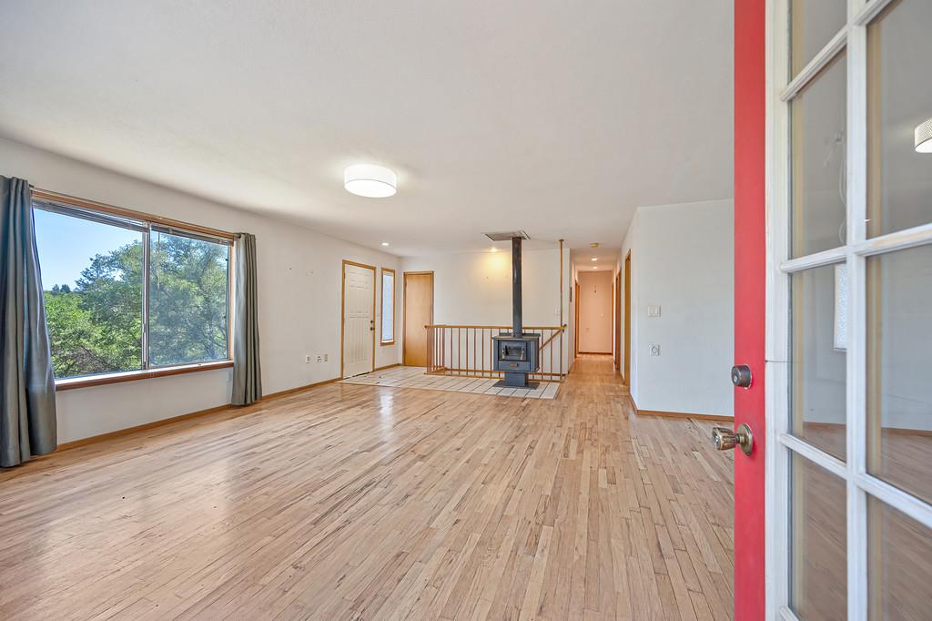 4751 Meadowview Acres Road Cool, CA 95614 - Photo 5 of 51 a view of an empty room with wooden floor and a window
