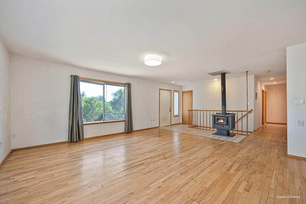 4751 Meadowview Acres Road Cool, CA 95614 - Photo 6 of 51 a view of an empty room with wooden floor and a window