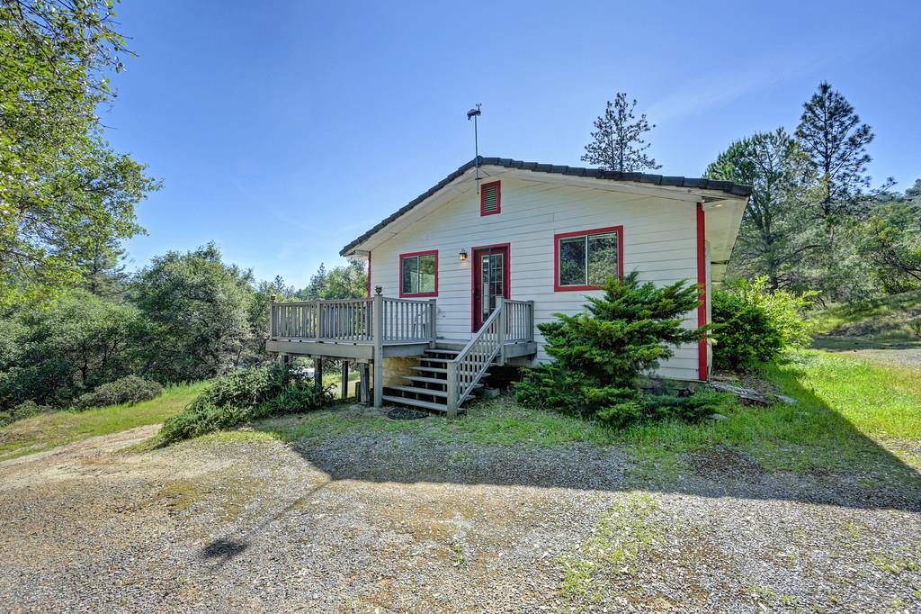 4751 Meadowview Acres Road Cool, CA 95614 - Photo 7 of 51 a front view of a house with a yard and garage