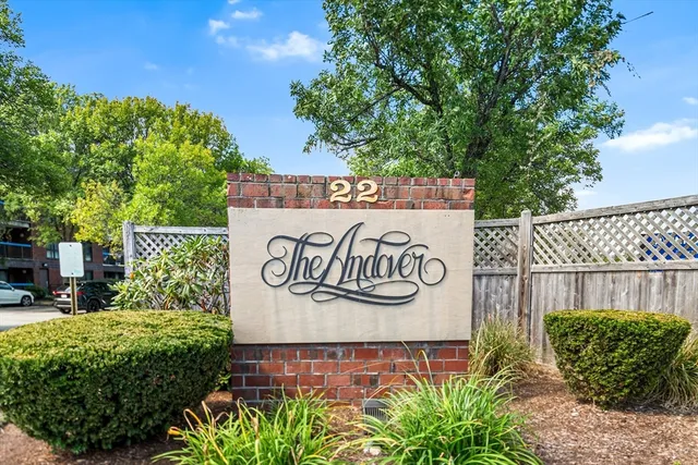 a sign that is on the wall of the building