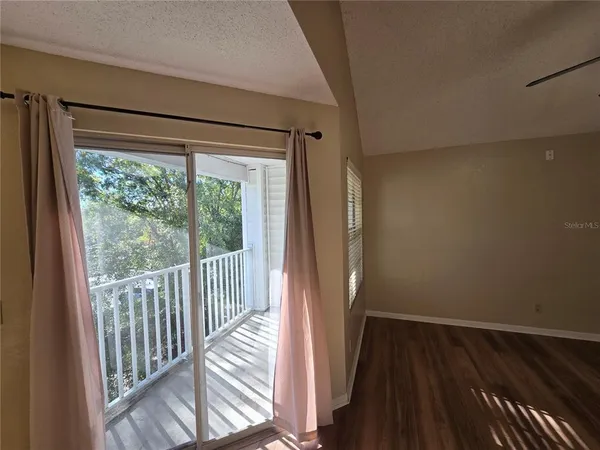 a view of a room with wooden floor and walls