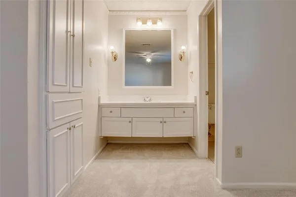 a view of a bathroom with mirror