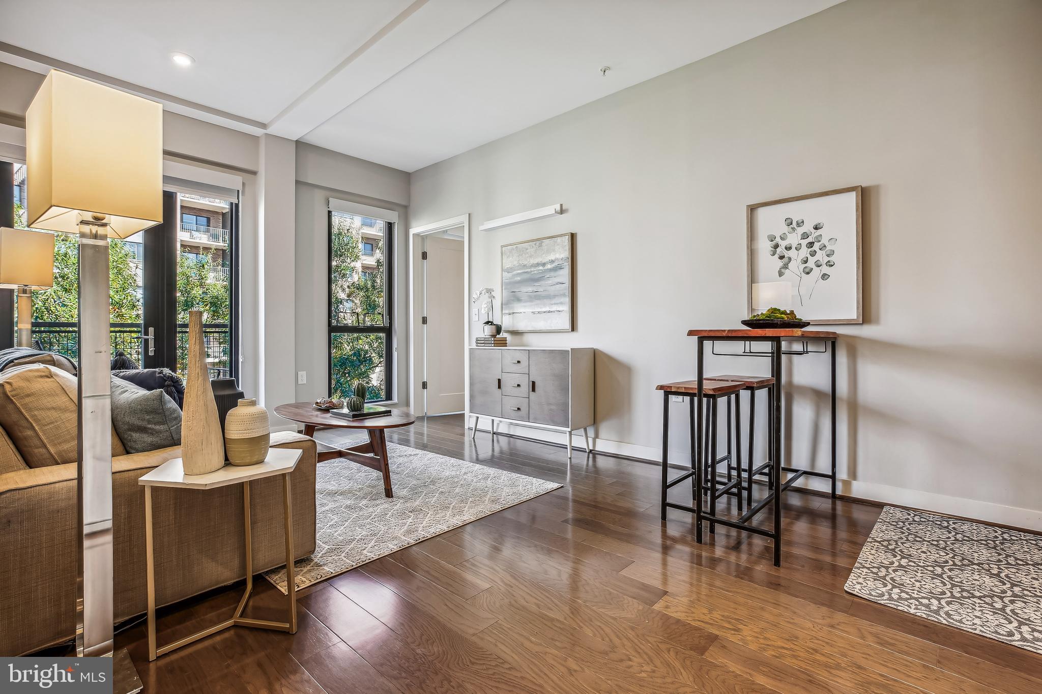 1320 Fenwick Lane, Unit 800 Silver Spring, MD 20910 - Photo 12 of 54 a living room with furniture and a large window