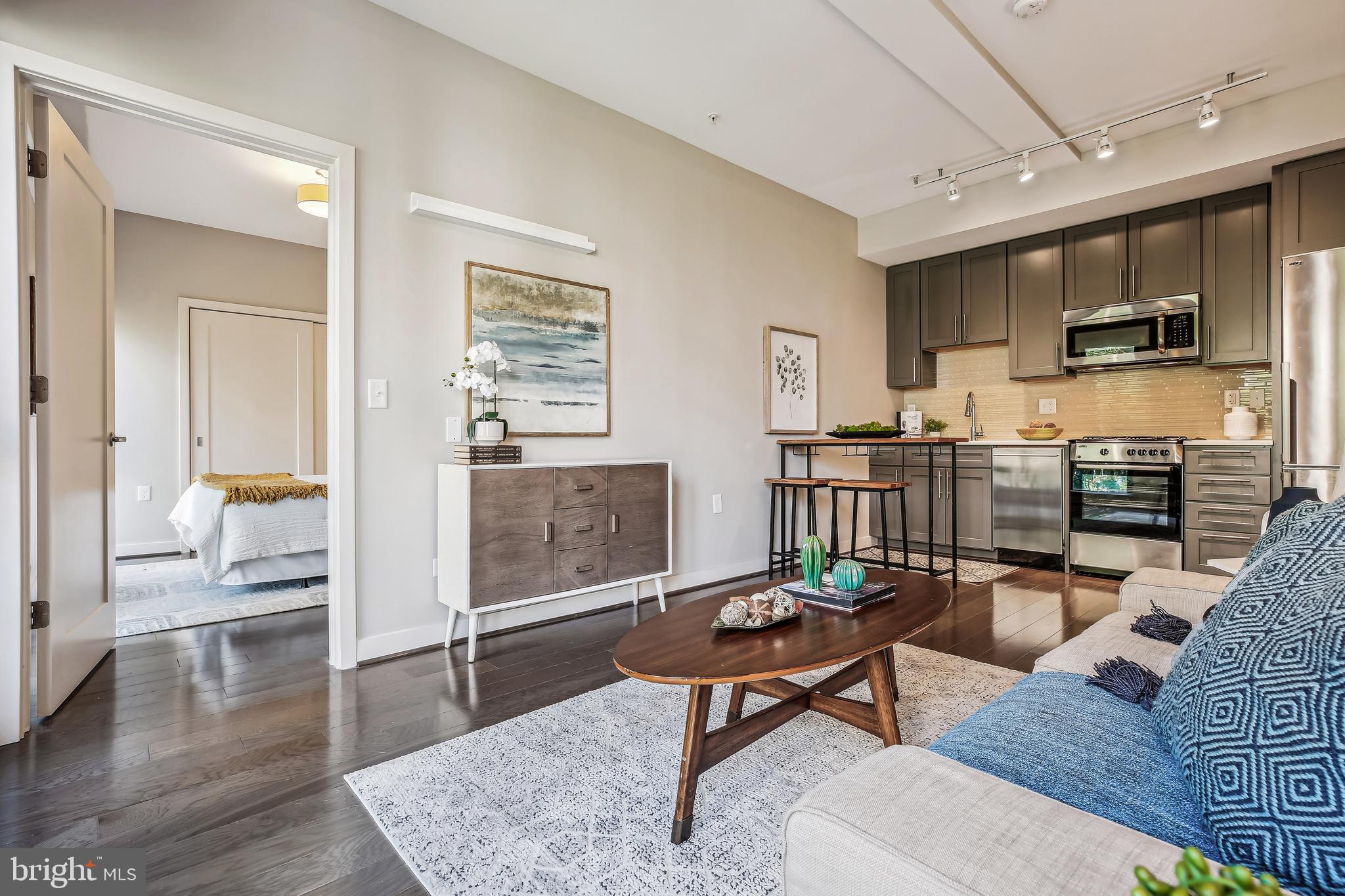 1320 Fenwick Lane, Unit 800 Silver Spring, MD 20910 - Photo 14 of 54 a living room with furniture and a wooden floor