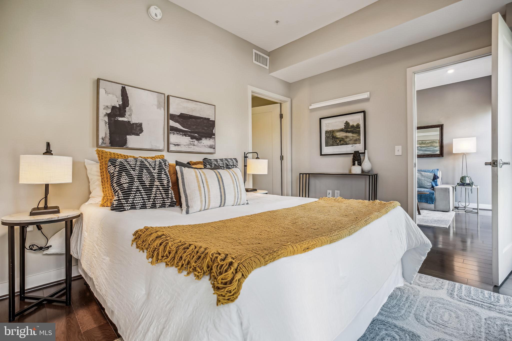 1320 Fenwick Lane, Unit 800 Silver Spring, MD 20910 - Photo 18 of 54 a bedroom with a bed and wooden floor