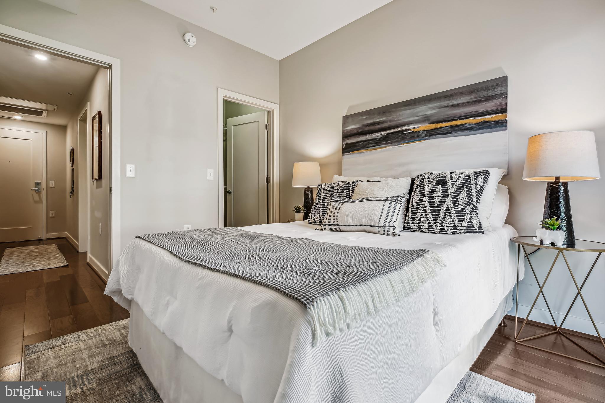 1320 Fenwick Lane, Unit 800 Silver Spring, MD 20910 - Photo 24 of 54 a bedroom with a bed and a walk in closet