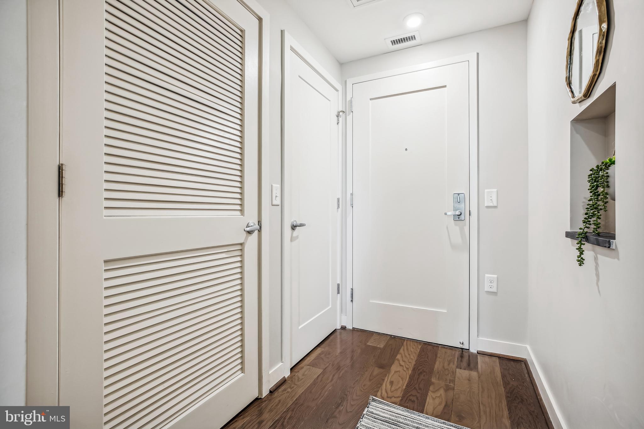 1320 Fenwick Lane, Unit 800 Silver Spring, MD 20910 - Photo 25 of 54 a view of a room with wooden floor and brick walls