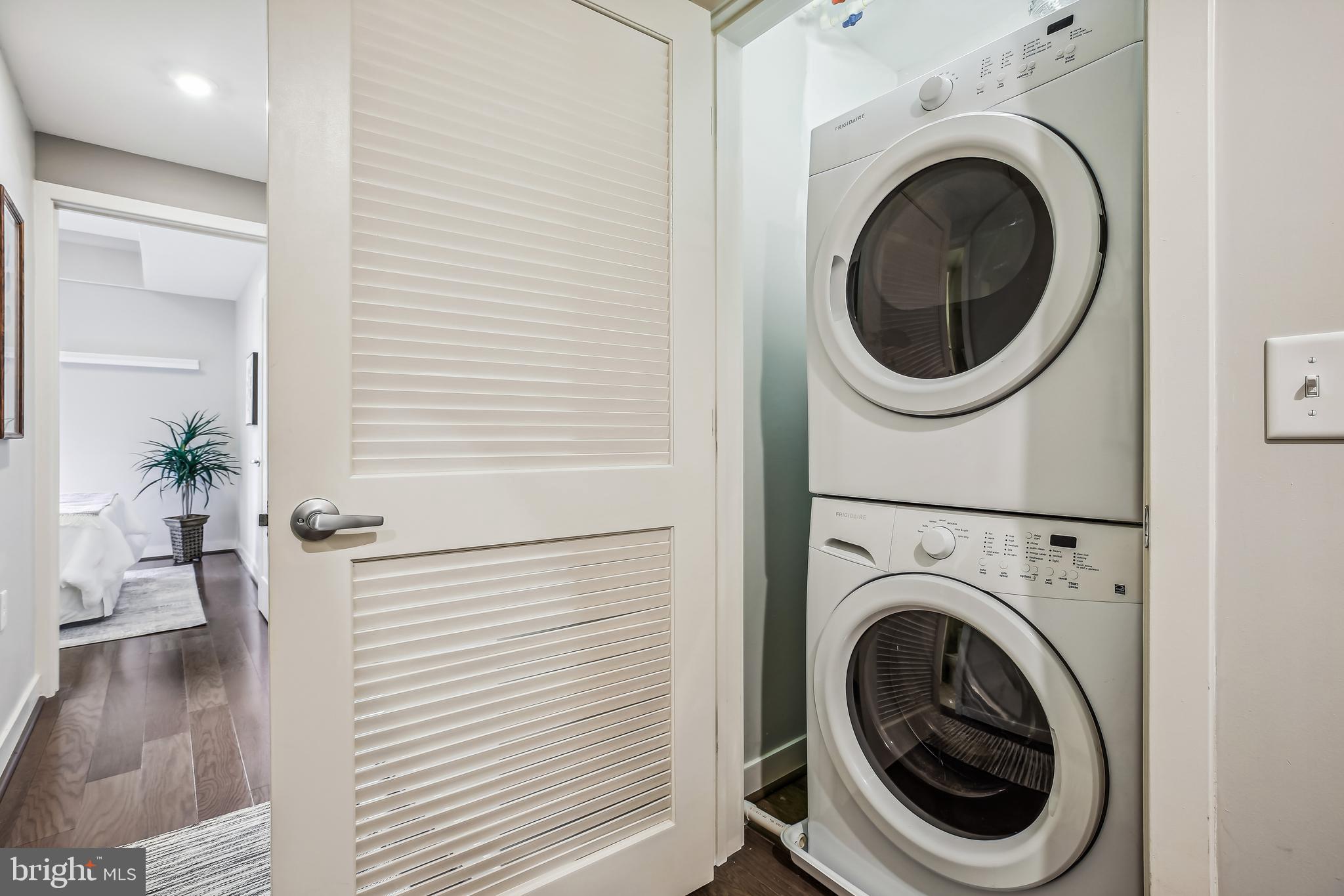 1320 Fenwick Lane, Unit 800 Silver Spring, MD 20910 - Photo 26 of 54 a view of a hallway with washer and dryer