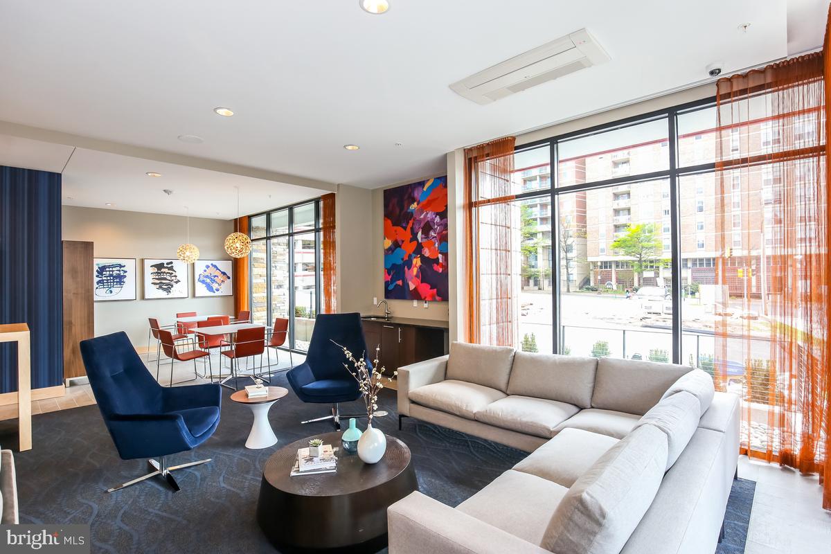 1320 Fenwick Lane, Unit 800 Silver Spring, MD 20910 - Photo 36 of 54 a living room with furniture and a large window
