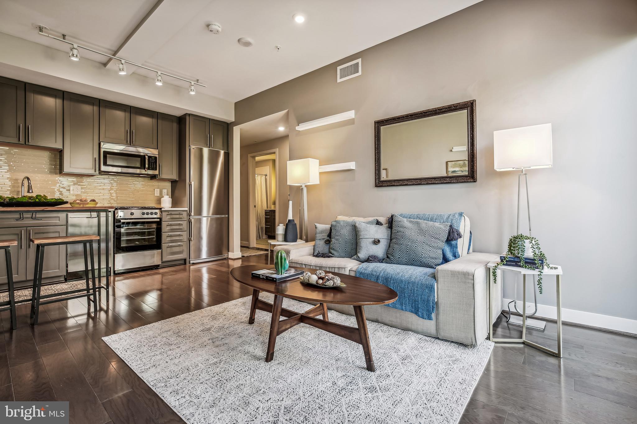 1320 Fenwick Lane, Unit 800 Silver Spring, MD 20910 - Photo 4 of 54 a living room with furniture and a wooden floor
