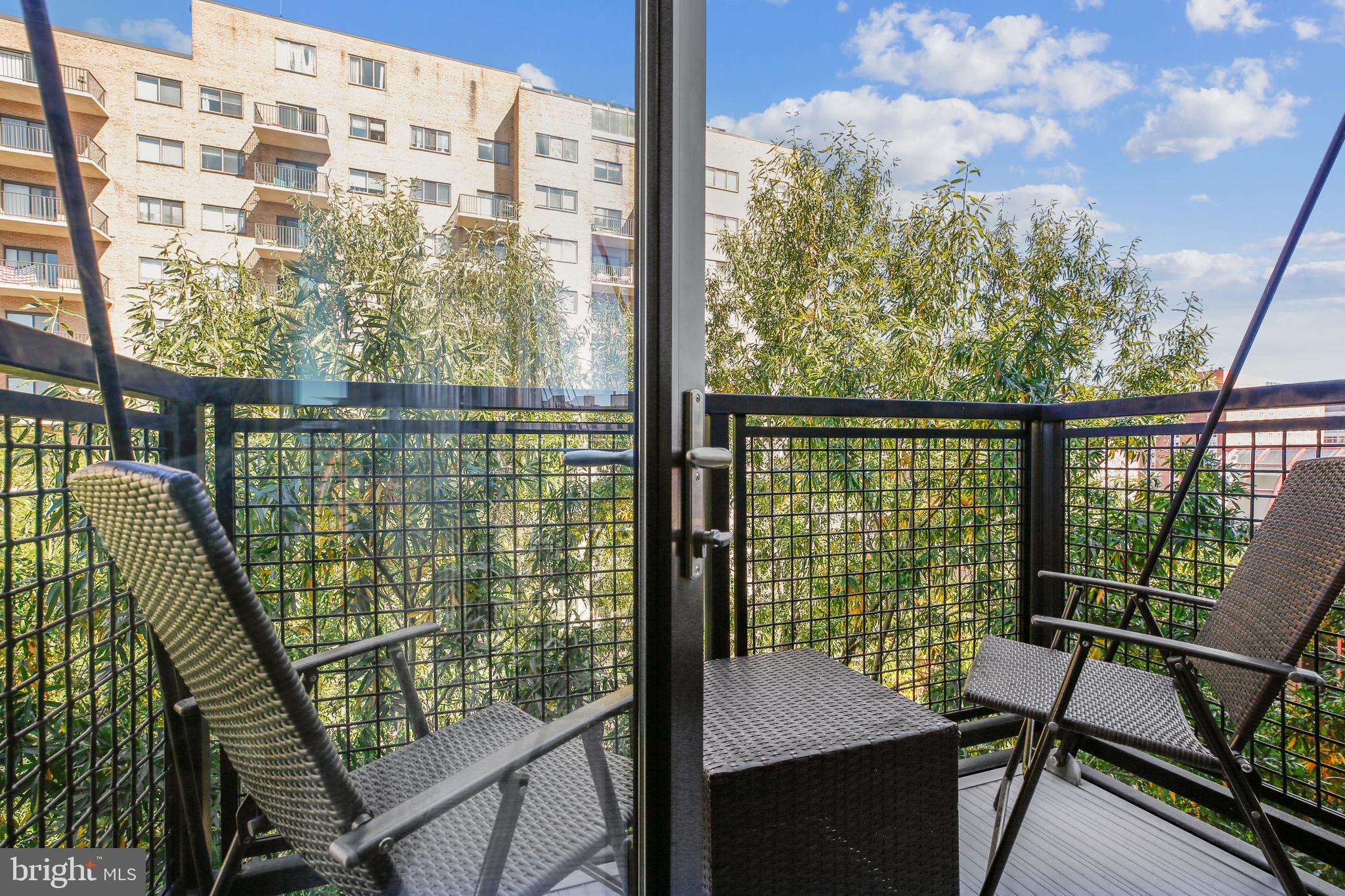 1320 Fenwick Lane, Unit 800 Silver Spring, MD 20910 - Photo 6 of 54 a view of a balcony with chairs