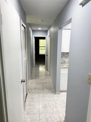 an entryway of a house and an empty room