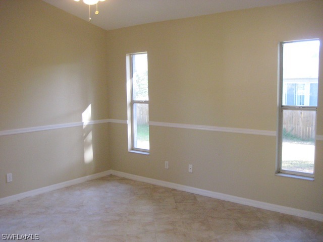 18229 Apple Road Fort Myers, FL 33967 - Photo 11 of 24 an empty room with windows