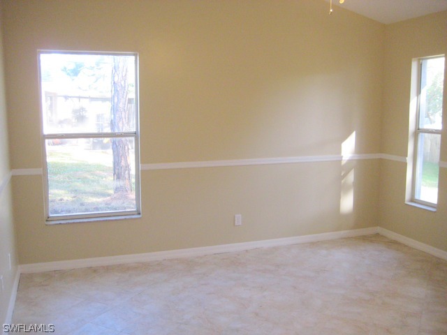 18229 Apple Road Fort Myers, FL 33967 - Photo 12 of 24 an empty room with a window