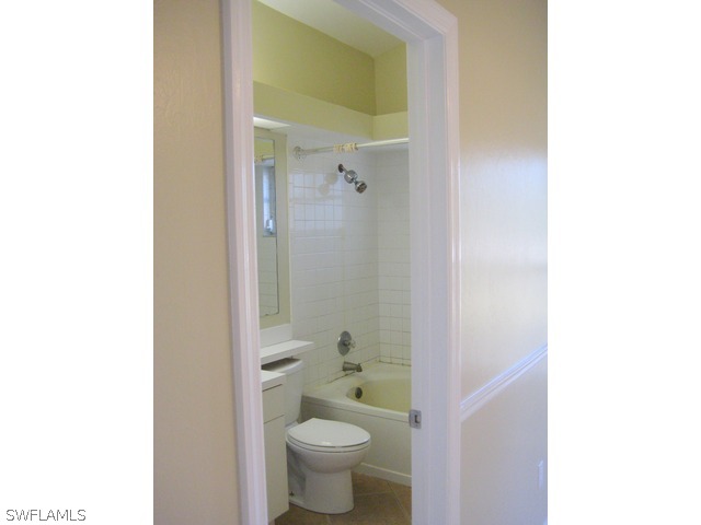 18229 Apple Road Fort Myers, FL 33967 - Photo 13 of 24 a bathroom with a toilet and a shower