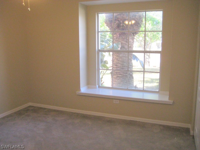 18229 Apple Road Fort Myers, FL 33967 - Photo 8 of 24 an empty room with a window