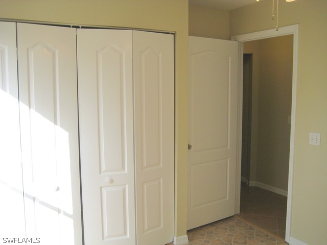 18229 Apple Road Fort Myers, FL 33967 - Photo 10 of 24 a view of a bathroom with a shower curtain