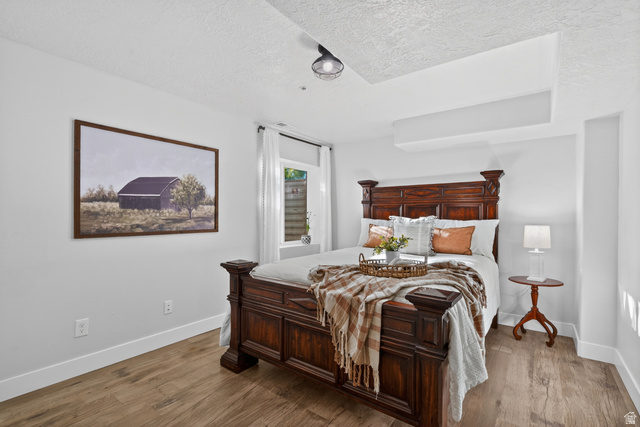 681 Island Road Morgan, UT 84050 - Photo 21 of 49 Bedroom featuring wood-finish flooring, white baseboards, and light-colored walls
