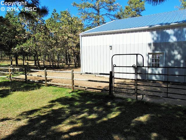 8535 Swan Road Colorado Springs, CO 80908 - Photo 13 of 25 Side Entry To Indoor Arena and Turn Out Area