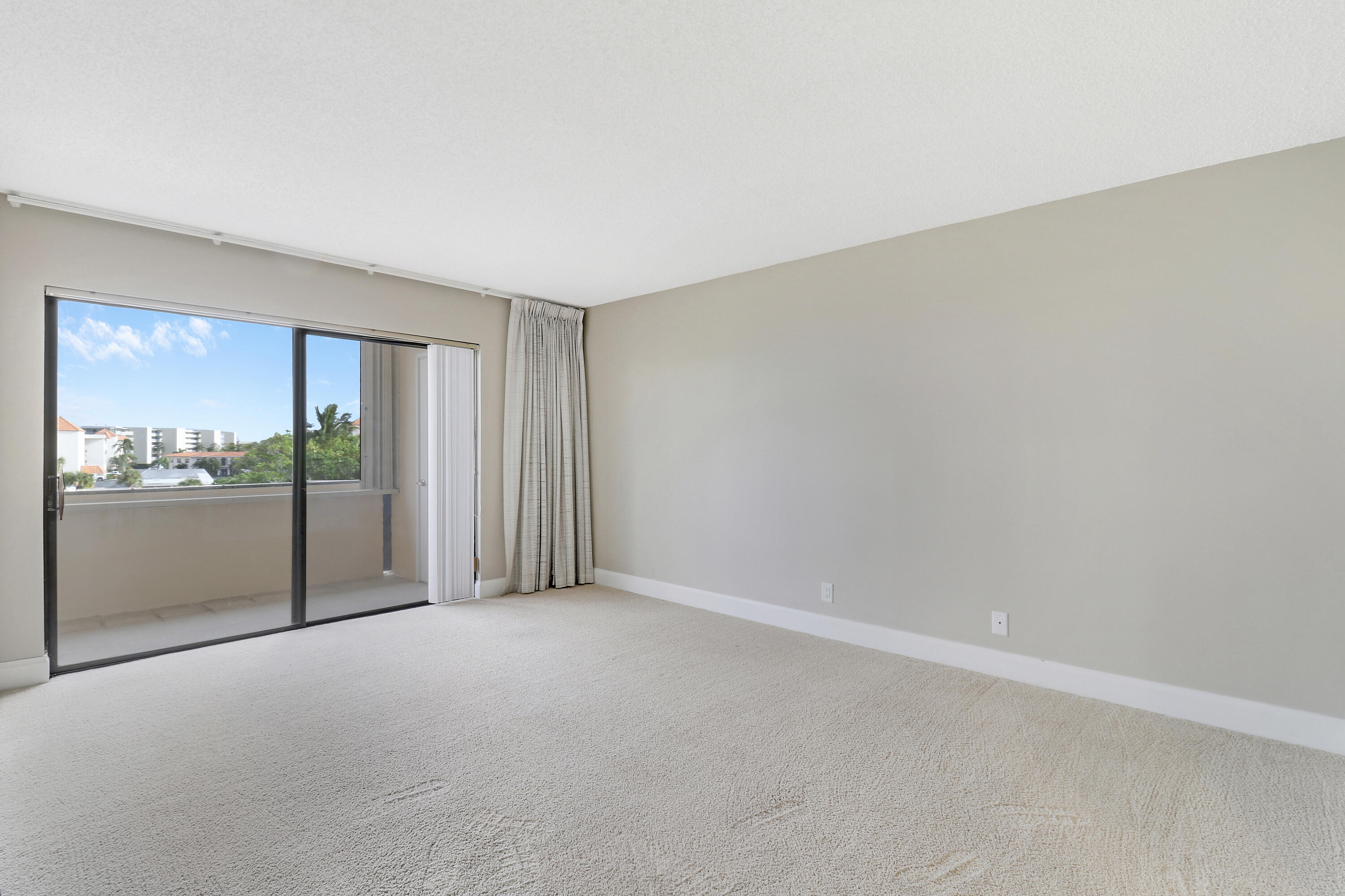 1036 Highway 1, Unit 321 North Palm Beach, FL 33408 - Photo 13 of 40 a view of an empty room with a window