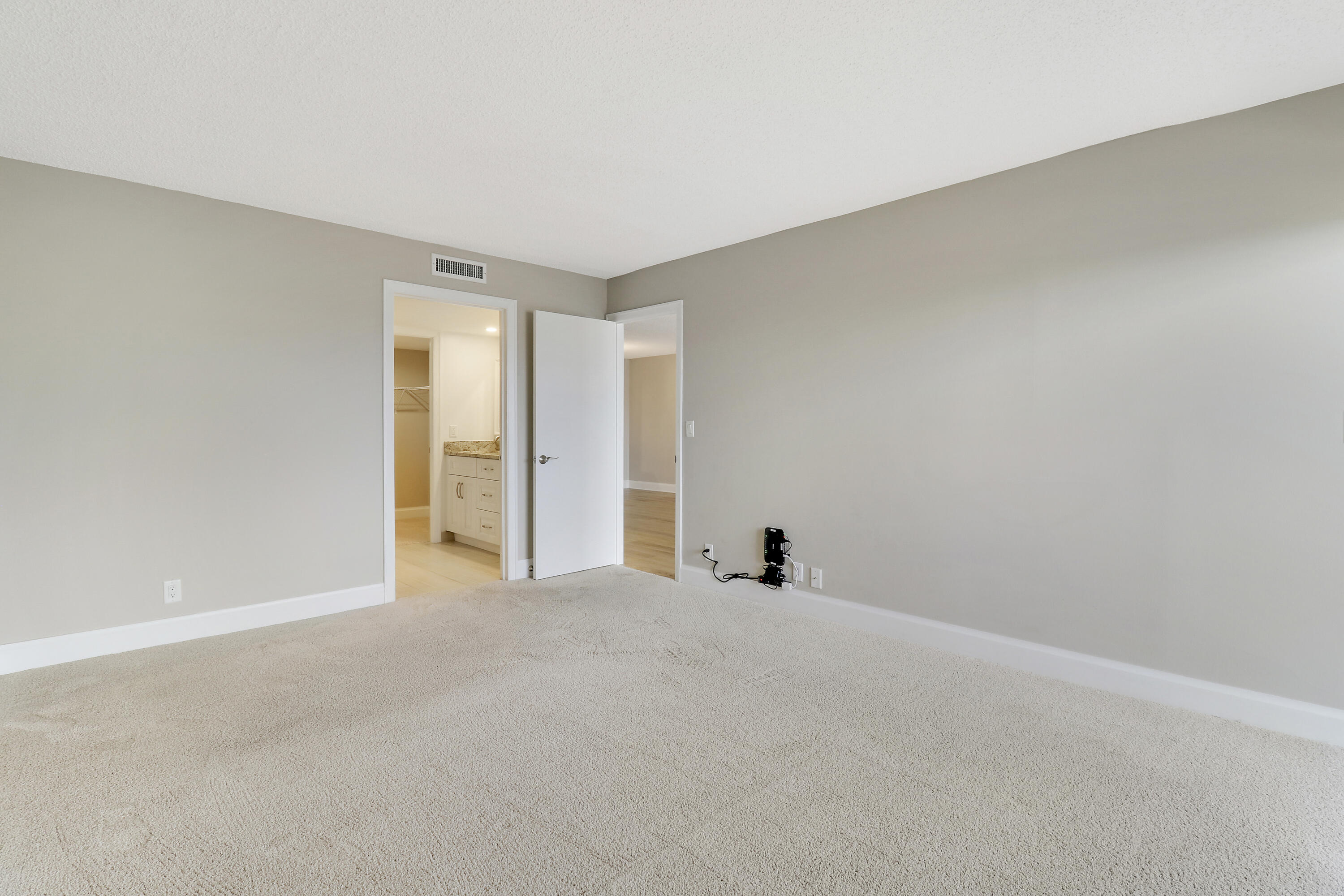 1036 Highway 1, Unit 321 North Palm Beach, FL 33408 - Photo 15 of 40 a view of an empty room with closet and a window