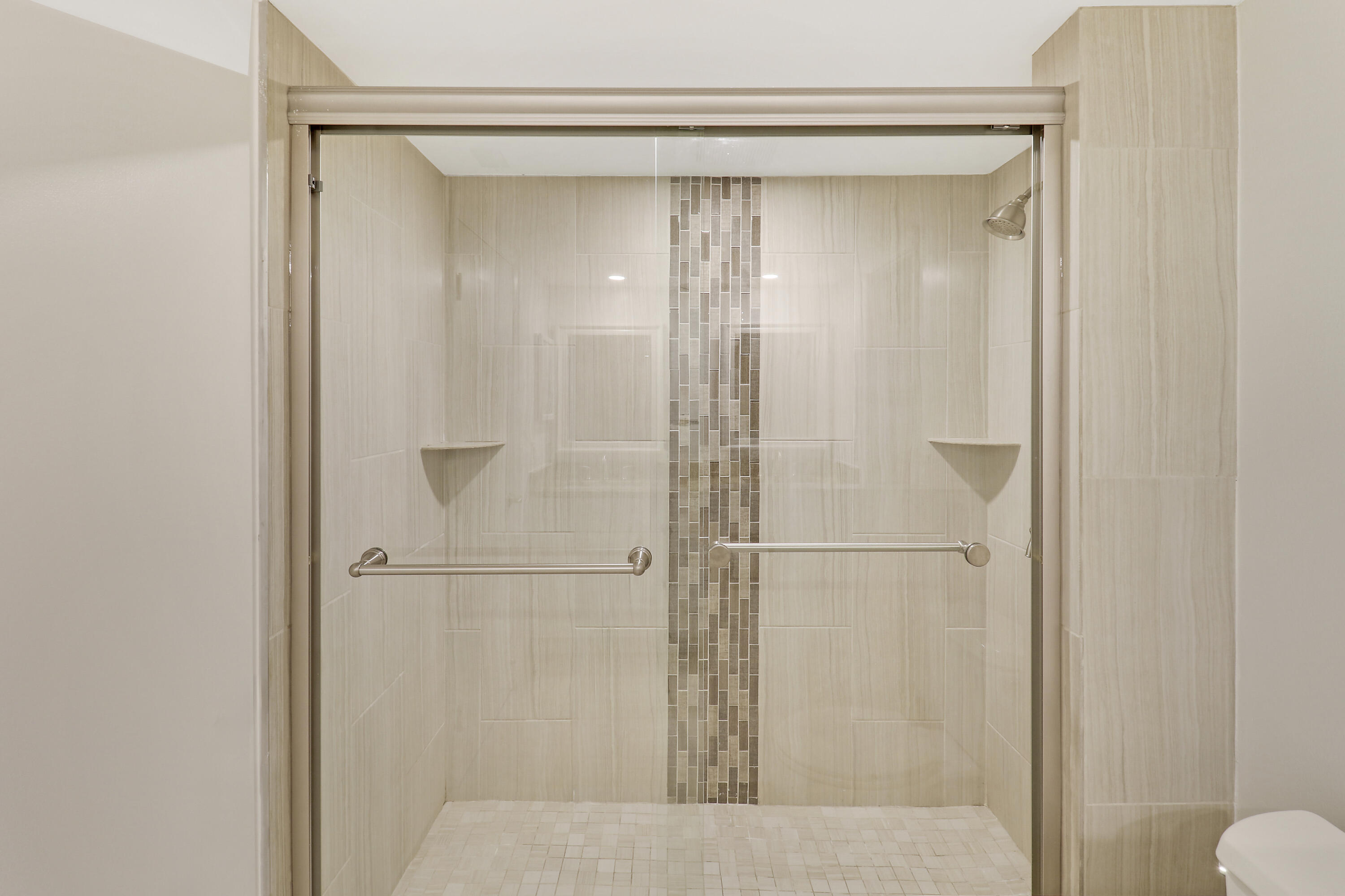 1036 Highway 1, Unit 321 North Palm Beach, FL 33408 - Photo 17 of 40 a bathroom with a glass shower door