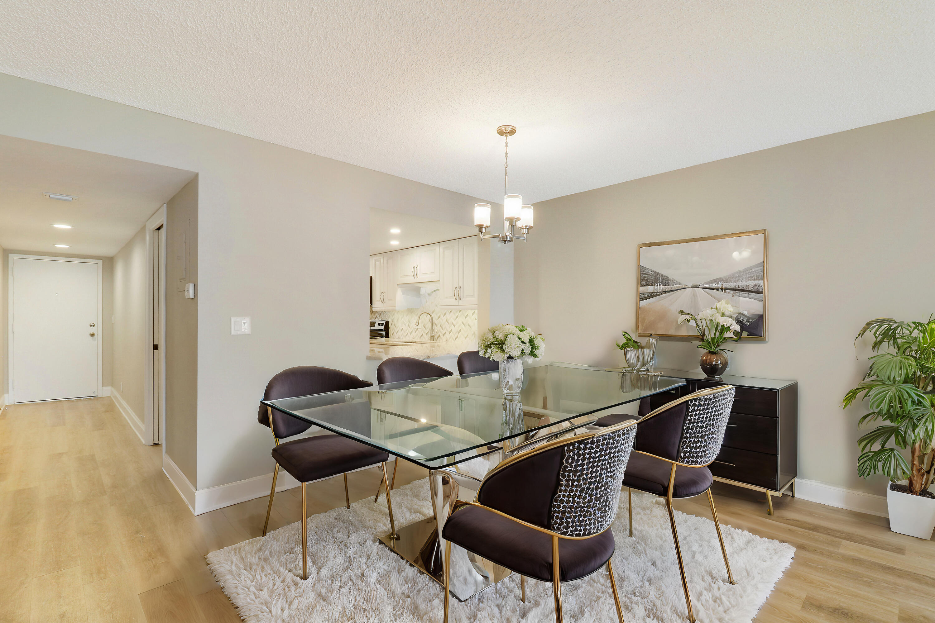 1036 Highway 1, Unit 321 North Palm Beach, FL 33408 - Photo 20 of 40 a view of a dining room with furniture and wooden floor