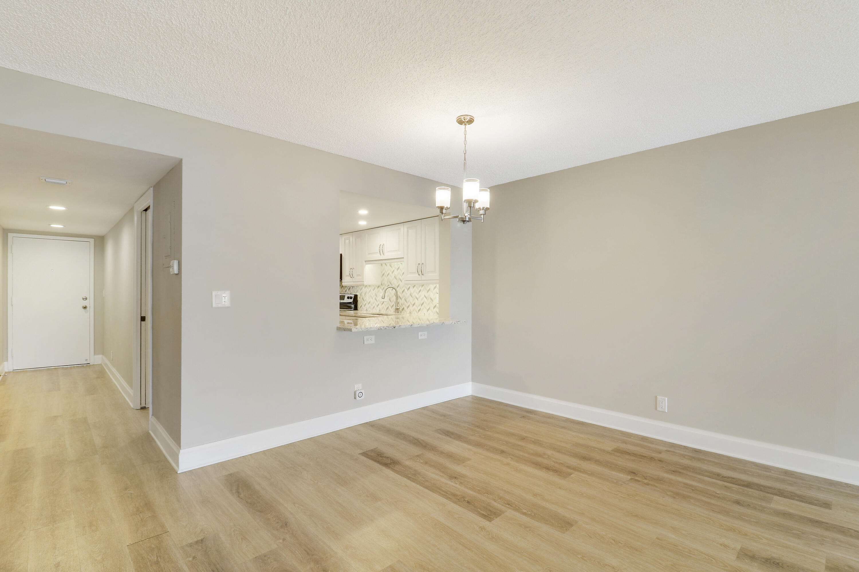 1036 Highway 1, Unit 321 North Palm Beach, FL 33408 - Photo 21 of 40 wooden floor in an empty room with a window