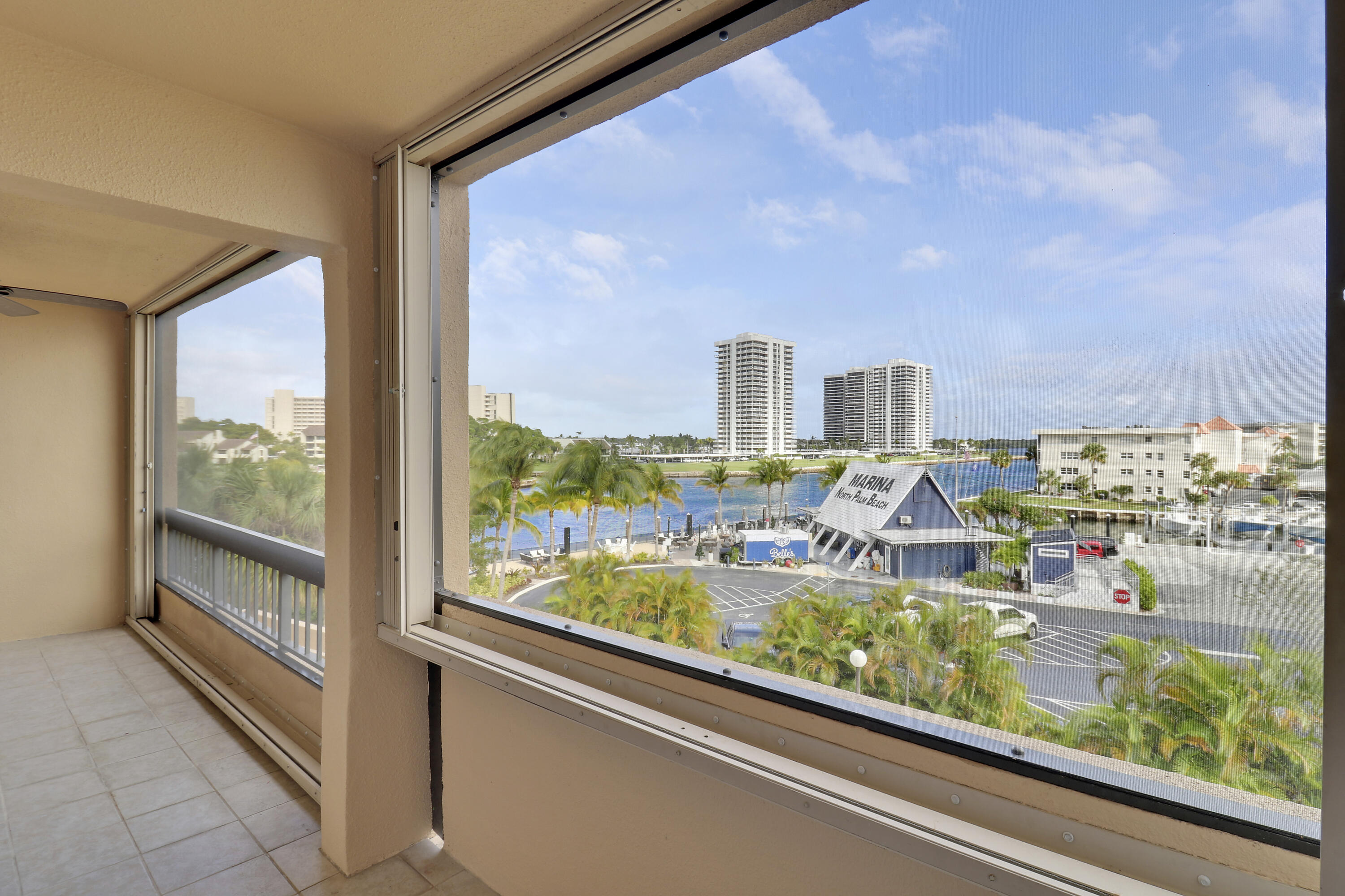 1036 Highway 1, Unit 321 North Palm Beach, FL 33408 - Photo 32 of 40 a view of a city from a balcony with furniture